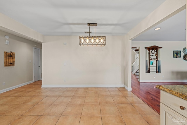 2950 Coral Strip Pkwy, Gulf Breeze, FL 32563 - unfurnished dining area featuring stairs, light tile patterned floors, baseboards, and recessed lighting