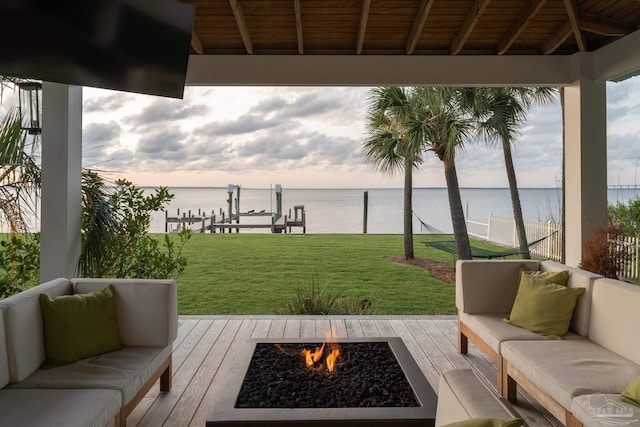 2950 Coral Strip Pkwy, Gulf Breeze, FL 32563 - wooden terrace featuring a water view, an outdoor living space with a fire pit, and a yard