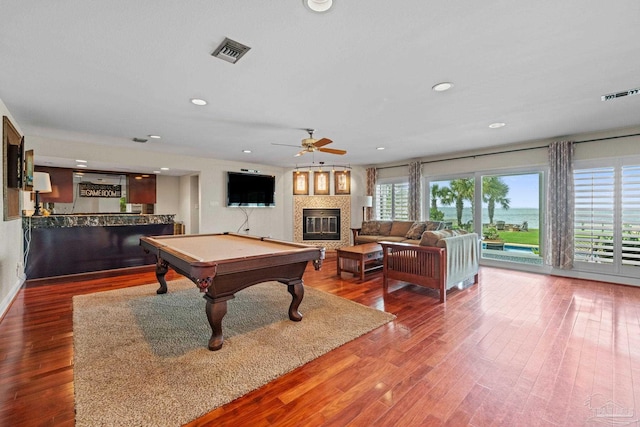 2950 Coral Strip Pkwy, Gulf Breeze, FL 32563 - recreation room with a glass covered fireplace, ceiling fan, wood finished floors, billiards table, and recessed lighting