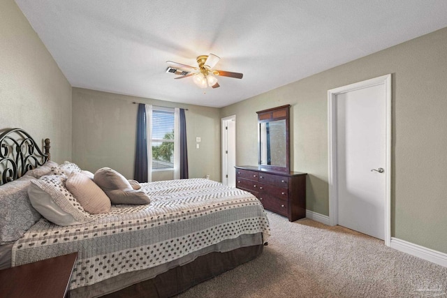 2950 Coral Strip Pkwy, Gulf Breeze, FL 32563 - bedroom with light colored carpet, a ceiling fan, and baseboards