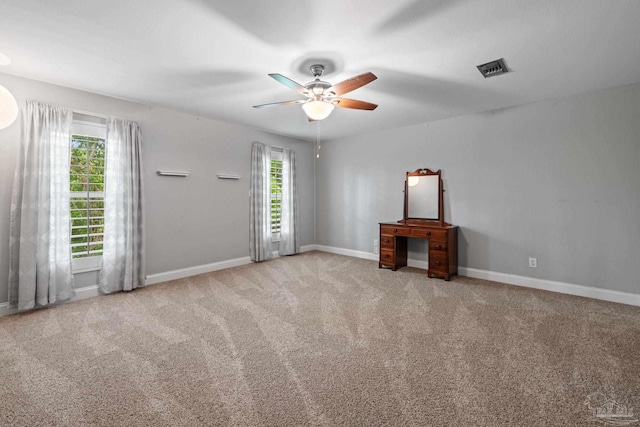 2950 Coral Strip Pkwy, Gulf Breeze, FL 32563 - unfurnished living room with a ceiling fan, carpet floors, and baseboards