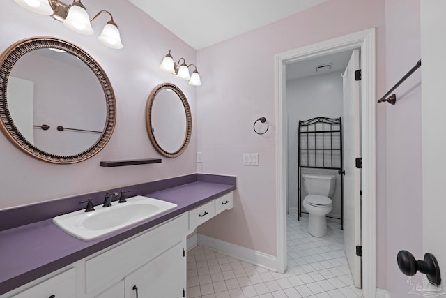 2950 Coral Strip Pkwy, Gulf Breeze, FL 32563 - bathroom featuring tile patterned flooring, vanity, baseboards, and toilet