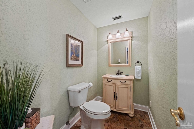 2950 Coral Strip Pkwy, Gulf Breeze, FL 32563 - bathroom featuring toilet, baseboards, and vanity