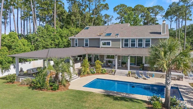 2950 Coral Strip Pkwy, Gulf Breeze, FL 32563 - rear view of property with a chimney and a patio