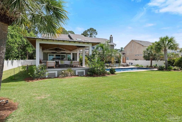 2950 Coral Strip Pkwy, Gulf Breeze, FL 32563 - rear view of property featuring an outdoor living space, a chimney, a patio, and a ceiling fan