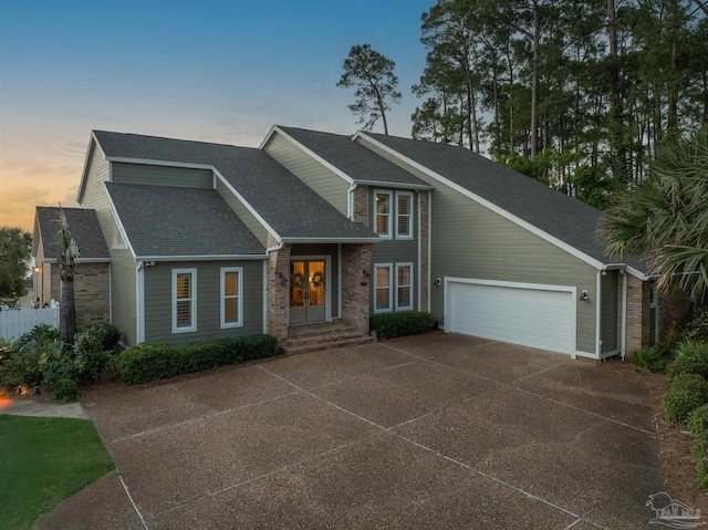 2950 Coral Strip Pkwy, Gulf Breeze, FL 32563 - view of front of house with driveway, an attached garage, and a shingled roof