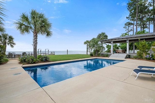 2950 Coral Strip Pkwy, Gulf Breeze, FL 32563 - swimming pool with a patio area, a water view, and a lawn