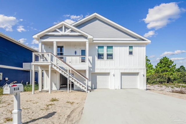 view of front of property with a porch and a garage