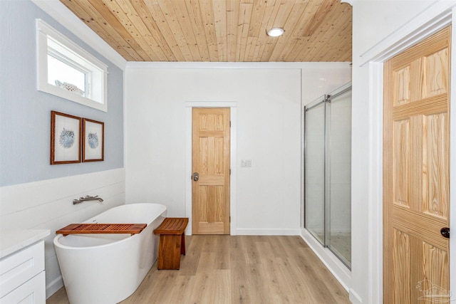 bathroom featuring wood-type flooring, shower with separate bathtub, and wooden ceiling