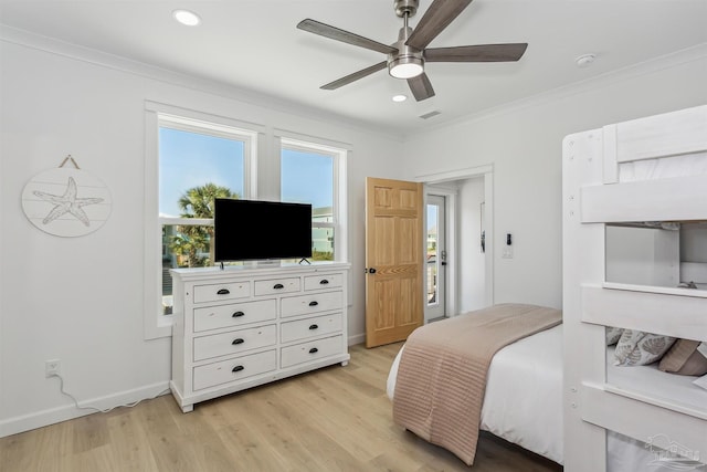 bedroom with crown molding, ceiling fan, and light hardwood / wood-style flooring