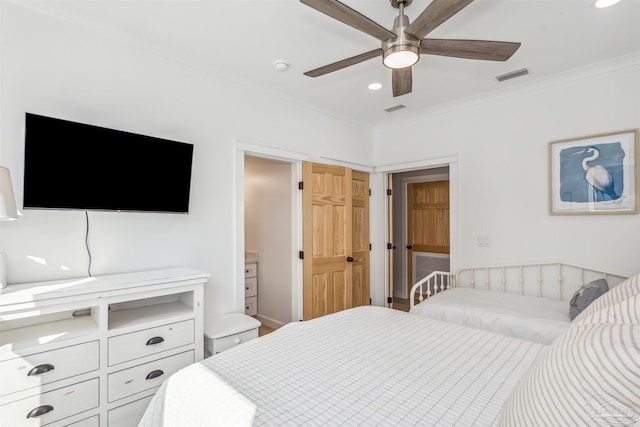 bedroom featuring ceiling fan and ornamental molding