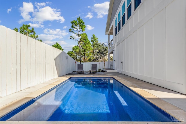 view of swimming pool featuring a patio