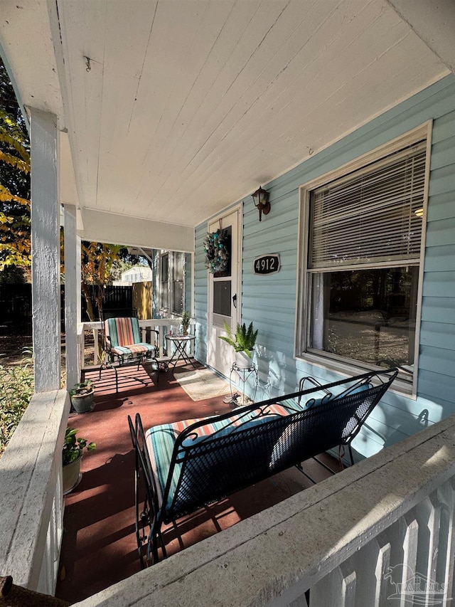 view of patio featuring a porch