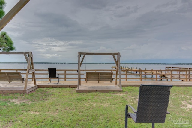 view of yard featuring a deck with water view