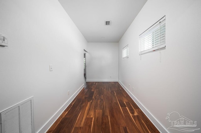 hall with dark hardwood / wood-style floors