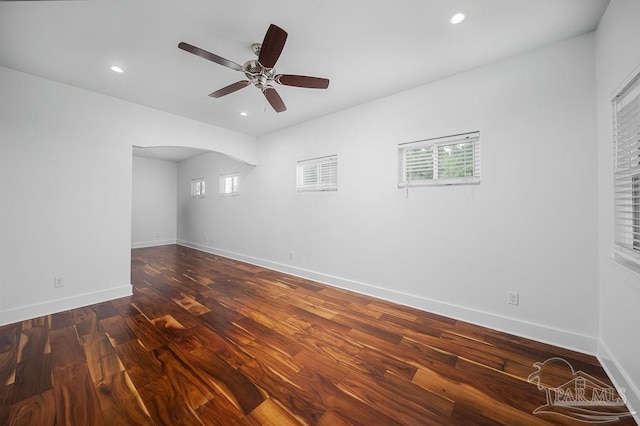 unfurnished room featuring dark hardwood / wood-style floors and ceiling fan