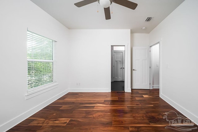 unfurnished bedroom with dark hardwood / wood-style flooring and ceiling fan