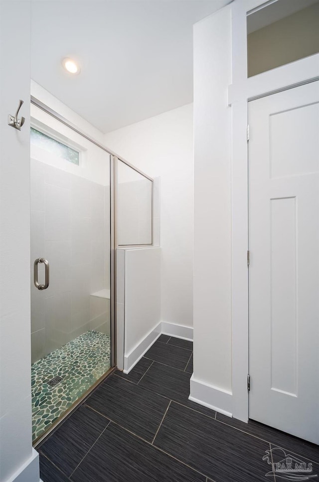 bathroom featuring an enclosed shower