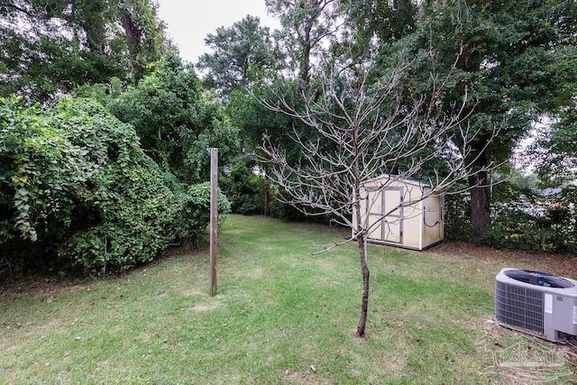 view of yard with a storage shed and cooling unit