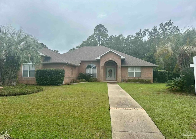 single story home with a front yard