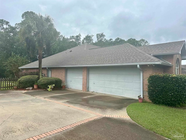 view of side of home featuring a garage