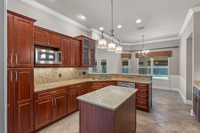 4166 Madura Four, Gulf Breeze, FL 32563 - kitchen featuring stainless steel appliances, a sink, a peninsula, tasteful backsplash, and light tile patterned flooring