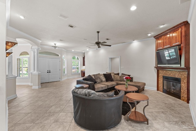 4166 Madura Four, Gulf Breeze, FL 32563 - living area with ornate columns, ornamental molding, arched walkways, light tile patterned floors, and a ceiling fan