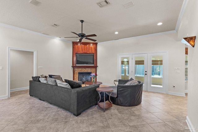 4166 Madura Four, Gulf Breeze, FL 32563 - living area with a glass covered fireplace, crown molding, french doors, a ceiling fan, and light tile patterned floors