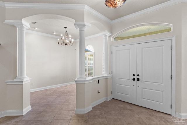 4166 Madura Four, Gulf Breeze, FL 32563 - entryway featuring arched walkways, decorative columns, light tile patterned flooring, a chandelier, and baseboards