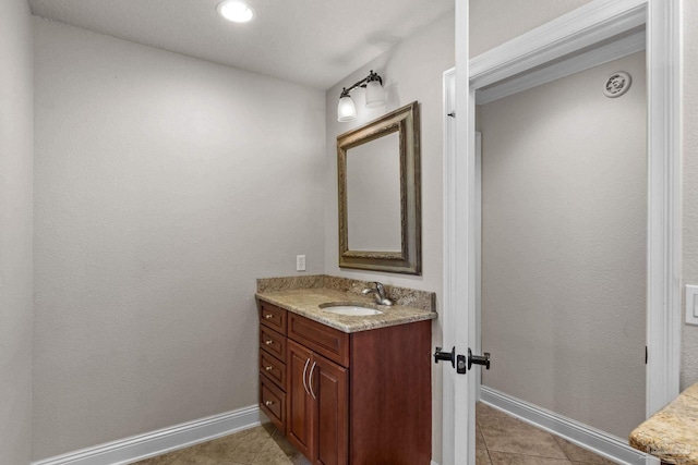 4166 Madura Four, Gulf Breeze, FL 32563 - bathroom featuring baseboards, tile patterned floors, and vanity