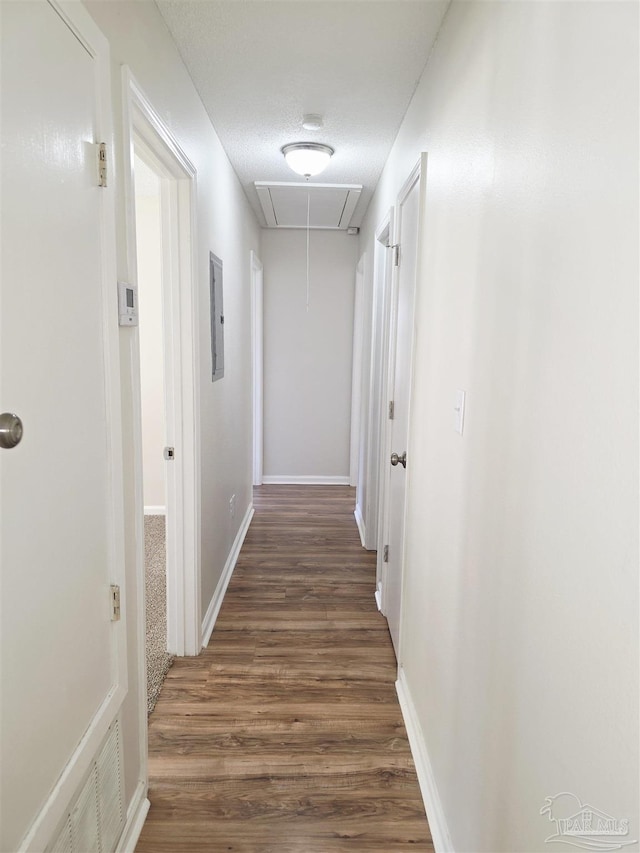 5666 Vestavia Ln, Pensacola, FL 32526 - hall with baseboards, attic access, and wood finished floors