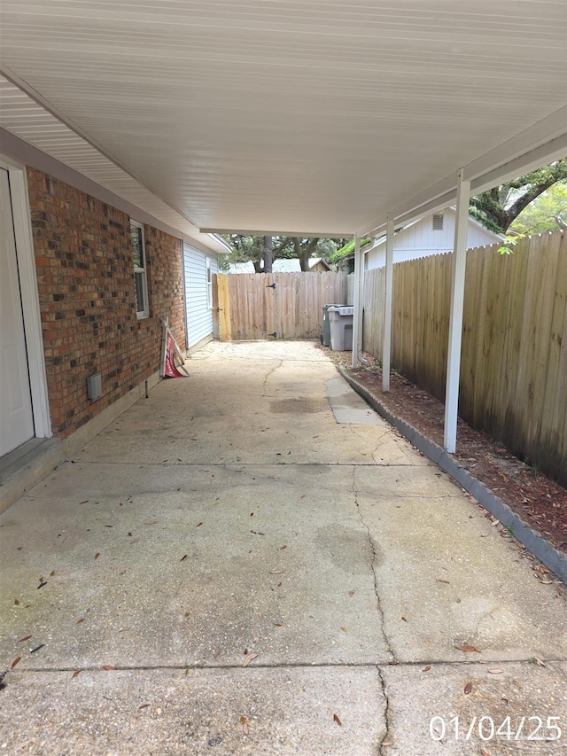 5666 Vestavia Ln, Pensacola, FL 32526 - view of patio / terrace featuring a carport and fence