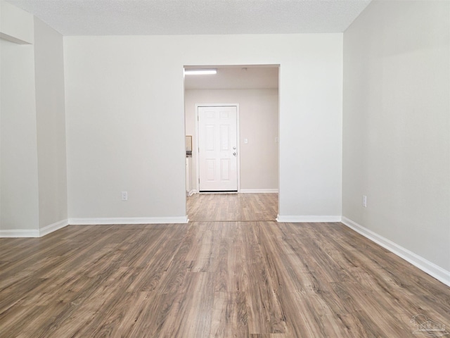 5666 Vestavia Ln, Pensacola, FL 32526 - spare room with baseboards and wood finished floors