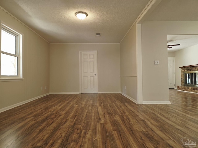 5666 Vestavia Ln, Pensacola, FL 32526 - unfurnished room with dark wood-type flooring, visible vents, crown molding, and a textured ceiling