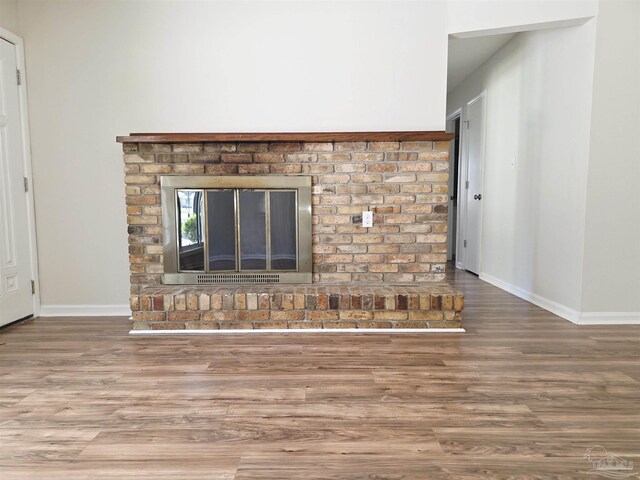 5666 Vestavia Ln, Pensacola, FL 32526 - room details with baseboards and wood finished floors