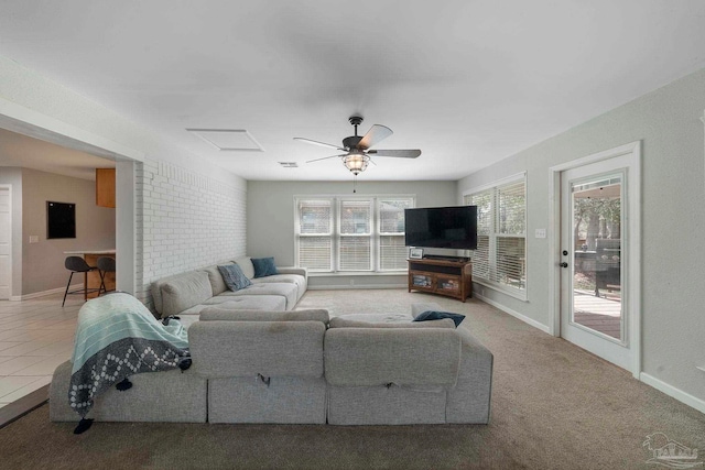 tiled living room with ceiling fan