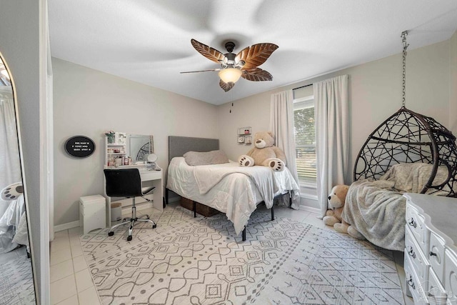 tiled bedroom with ceiling fan