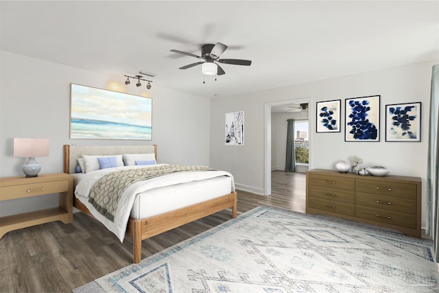 bedroom featuring ceiling fan and hardwood / wood-style flooring