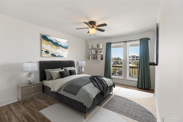 bedroom with ceiling fan, hardwood / wood-style flooring, and access to exterior