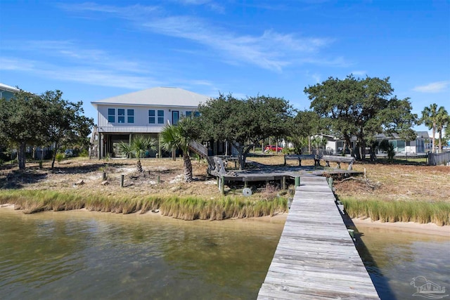 dock area with a water view