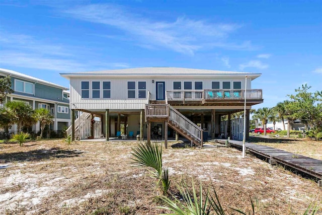 rear view of house with a carport