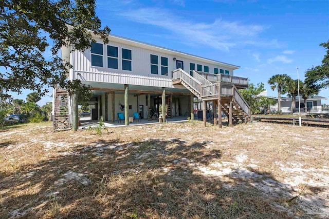 view of front of home with a patio area and a deck