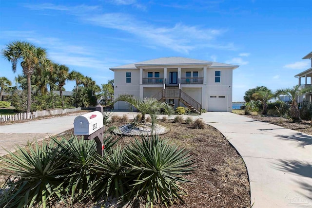 view of front of house with a garage and a porch