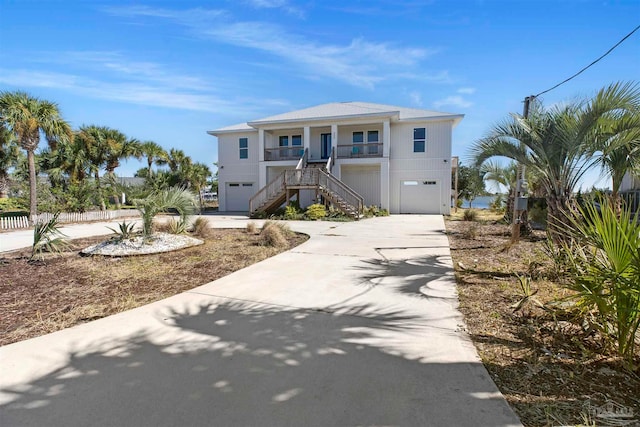 view of front of home with a garage and a porch