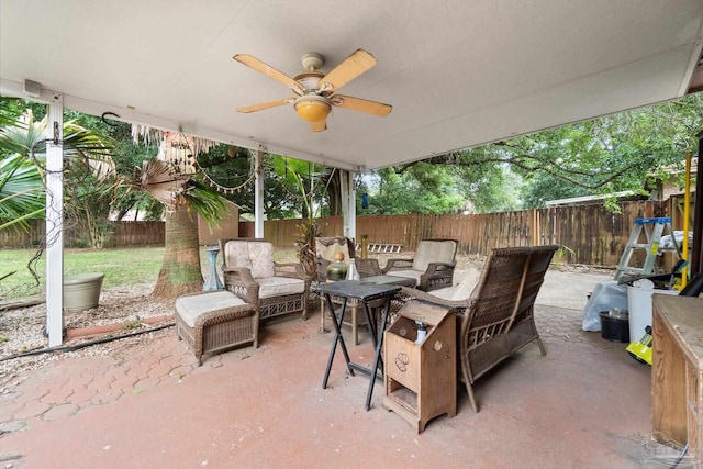 6555 Bellview Pines Pl, Pensacola, FL 32526 - fenced backyard with a patio, ceiling fan, and an outdoor living space