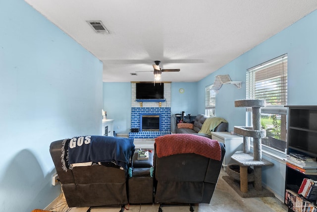 6555 Bellview Pines Pl, Pensacola, FL 32526 - living room with ceiling fan, a brick fireplace, and a textured ceiling