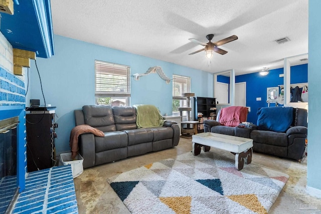 6555 Bellview Pines Pl, Pensacola, FL 32526 - living room featuring a ceiling fan and a textured ceiling