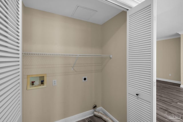 laundry room featuring hookup for an electric dryer, hookup for a washing machine, crown molding, and wood-type flooring