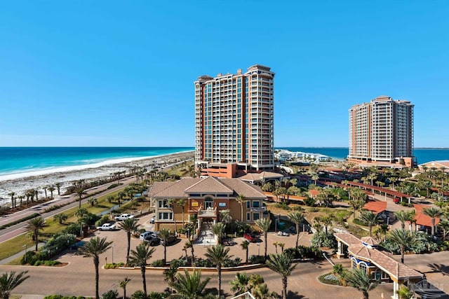 birds eye view of property featuring a view of the beach and a water view