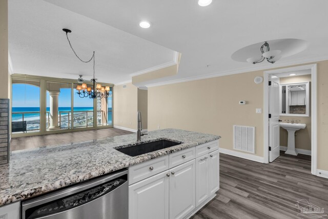 kitchen featuring dark wood-type flooring, dishwasher, decorative light fixtures, white cabinetry, and sink